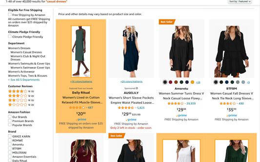 A search for "casual dresses" with the extension highlighting Amazon branded products orange.